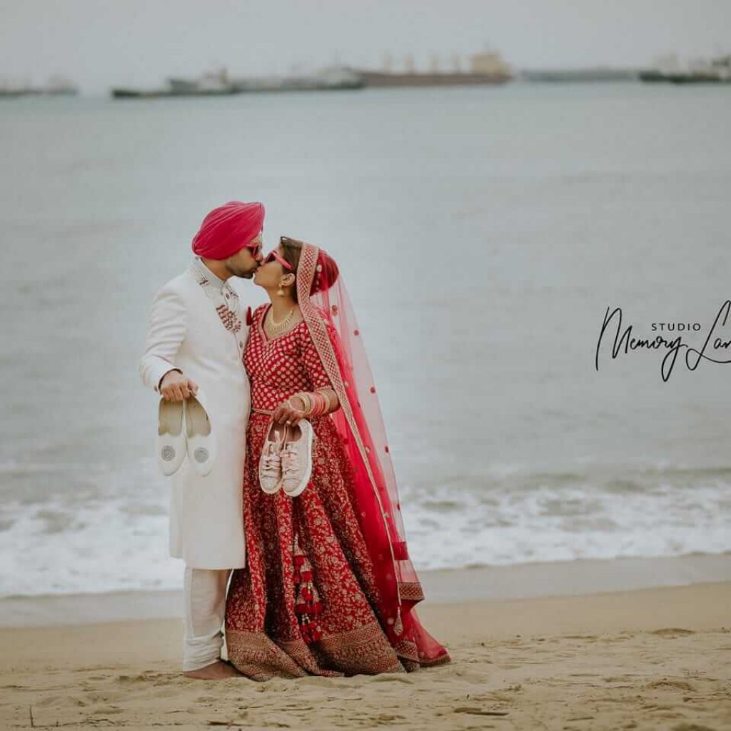 Punjabi Wedding Couple in Green and Pink Sari